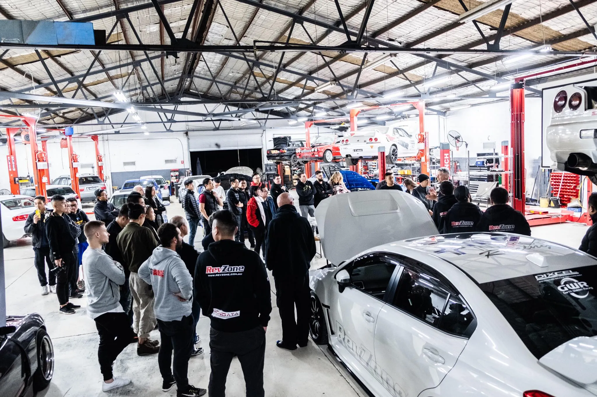 Revzone workshop floor with 4WD Mainline dynamometer and multiple service bays