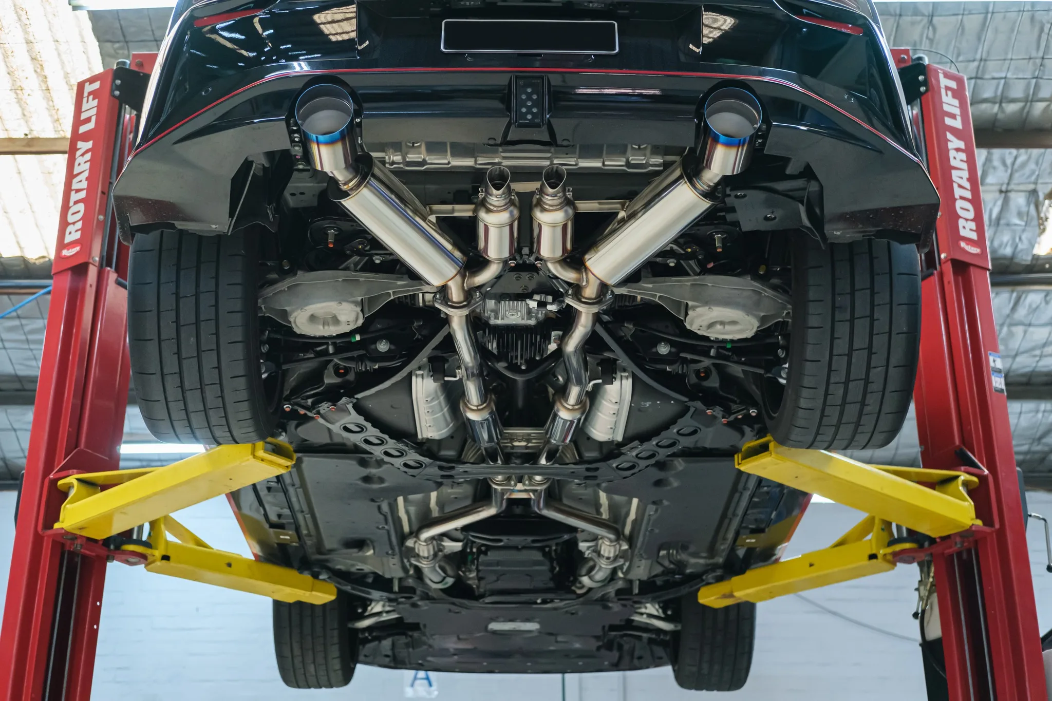 HKS Full Dual Muffler titanium tips on Nissan Z NISMO