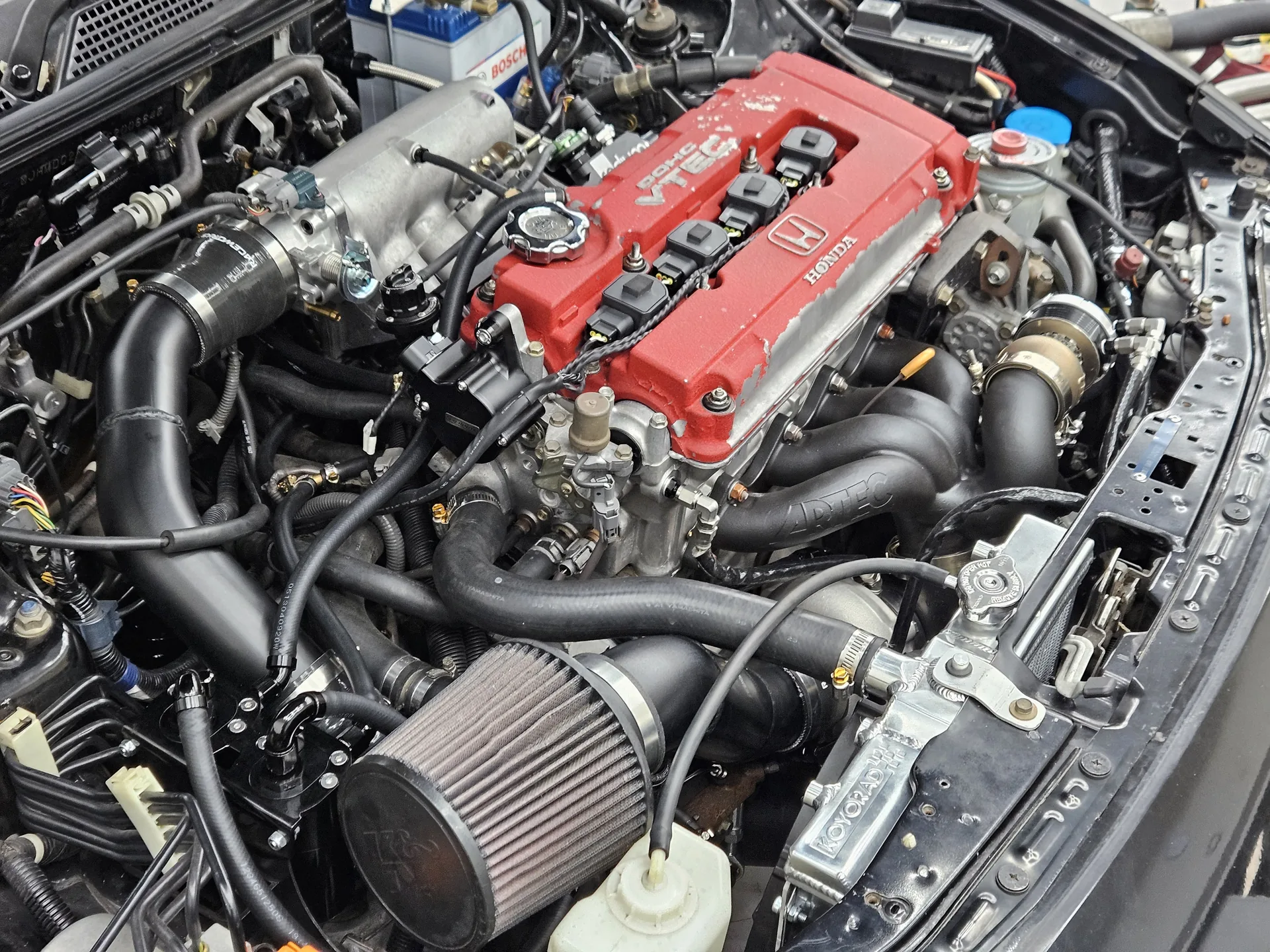 DC2 Integra Type R engine bay with the B18C, coil-on-plug ignition, intercooler piping and pod filter