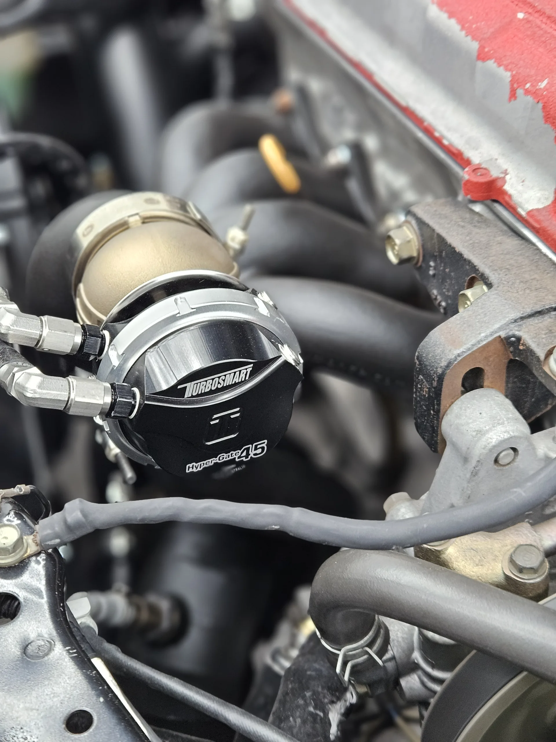 Turbosmart GenV HyperGate45 external wastegate on the DC2's turbo manifold