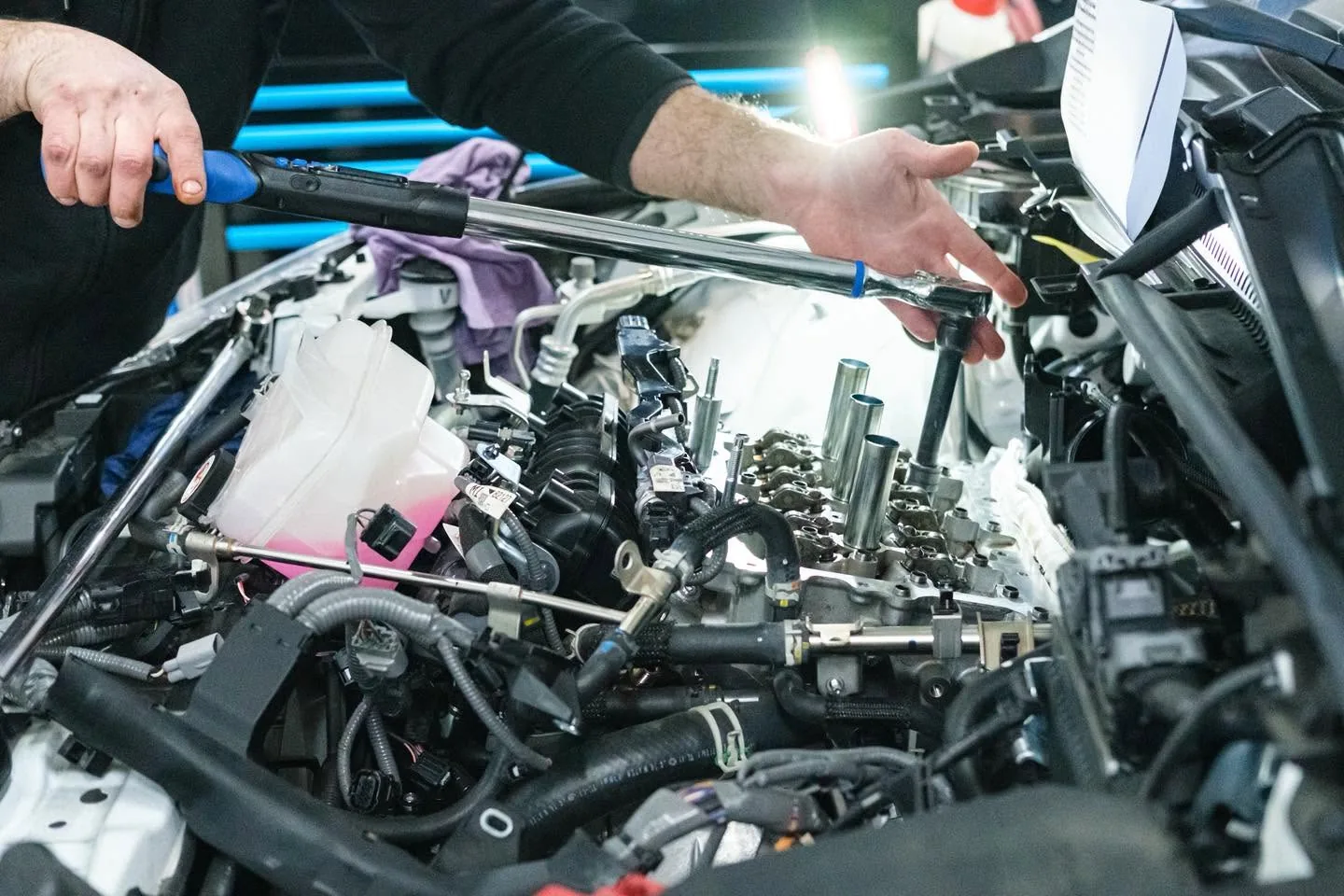 Technician torquing the cam caps on a GR Corolla G16E cylinder head