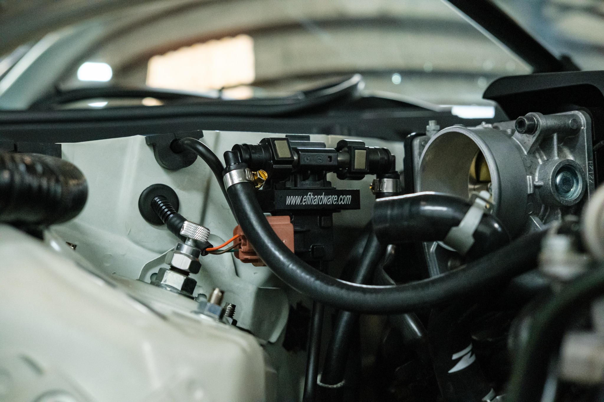 EFI Hardware flex fuel sensor installed in 370Z engine bay