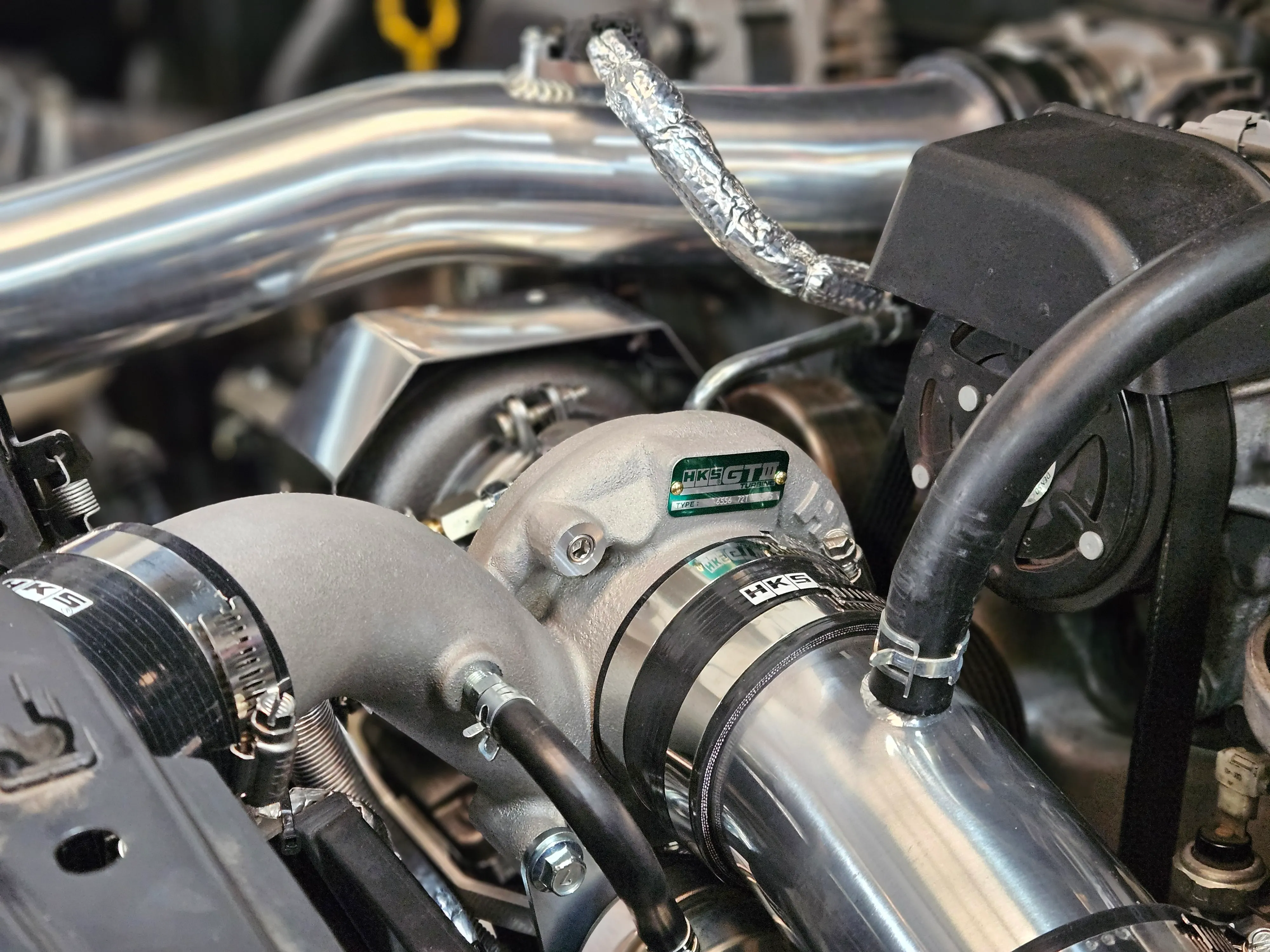 HKS GTIII-RS turbocharger installed in Toyota 86 engine bay with charge piping