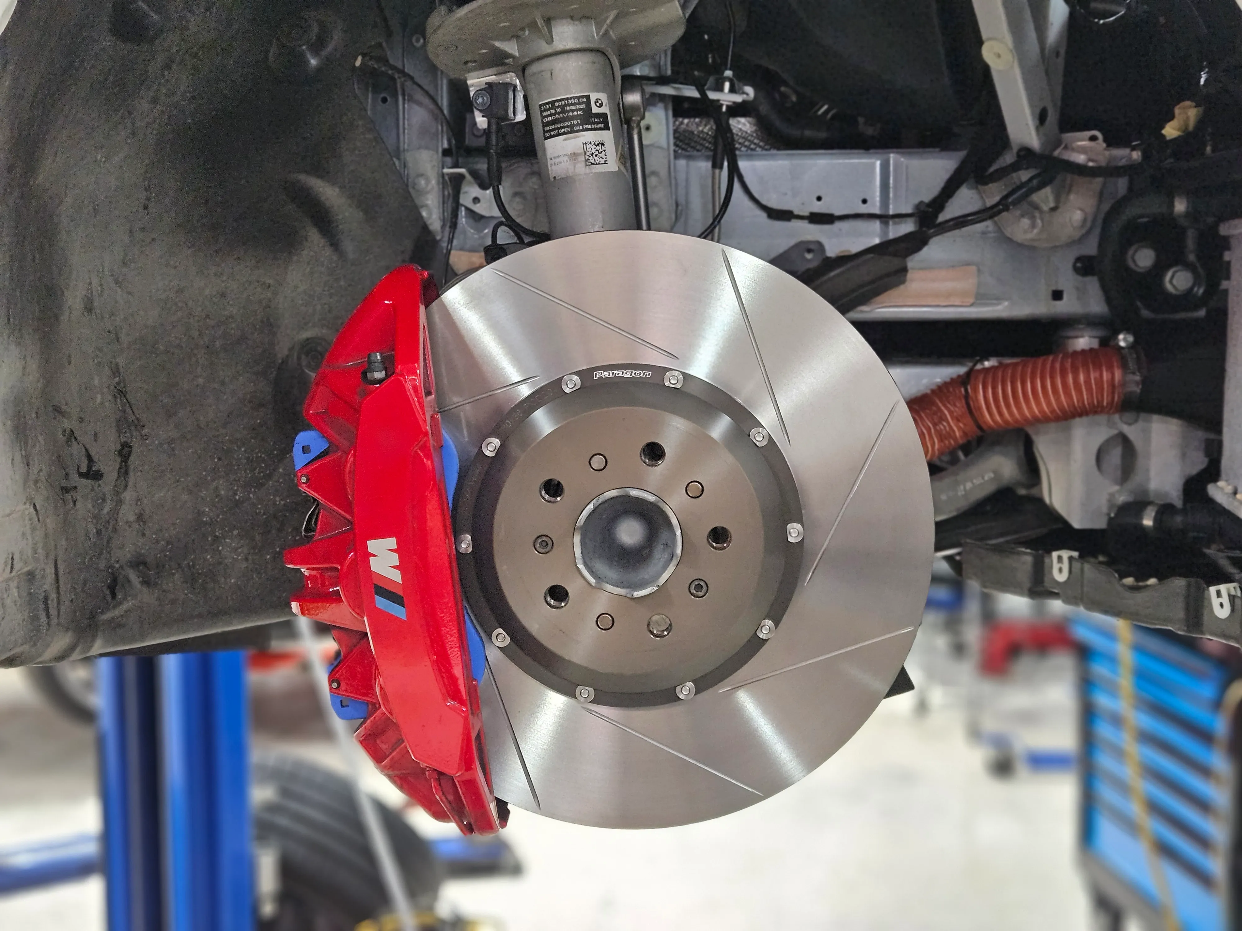 Paragon 2-piece front rotor installed on BMW G87 M2 with M compound caliper