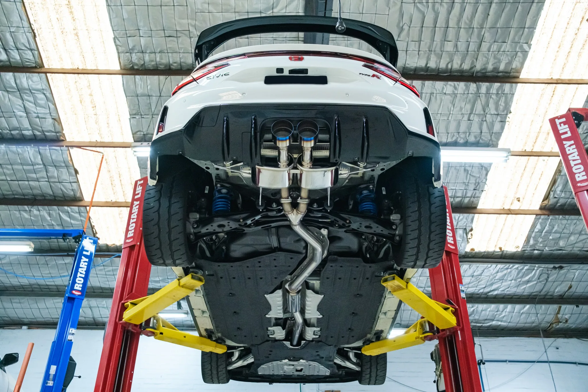 HKS Legamax Sports exhaust installed on Honda Civic Type R FL5 viewed from underneath showing titanium tips and piping