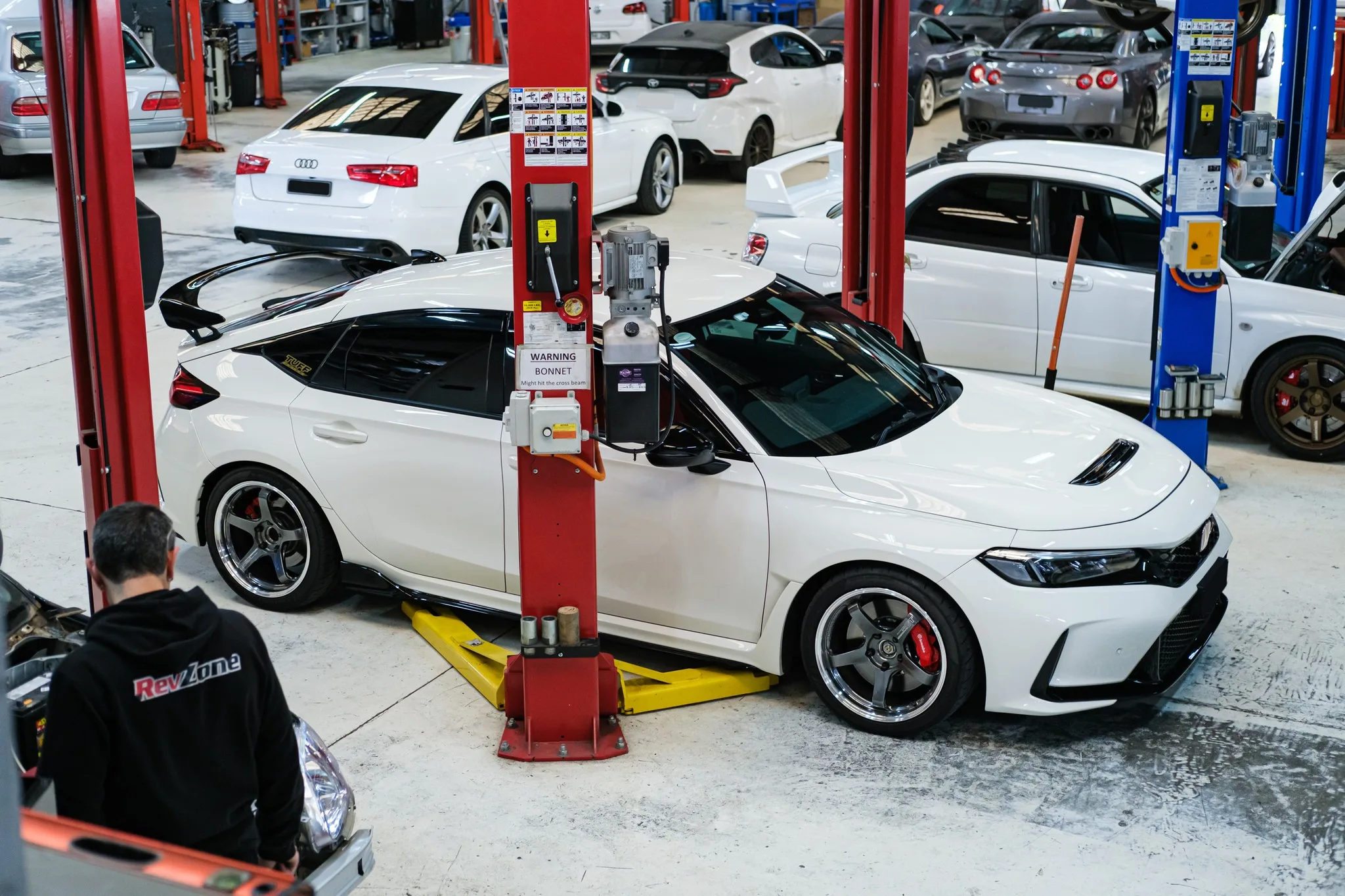 White Honda Civic Type R FL5 on the hoist at Revzone Melbourne workshop