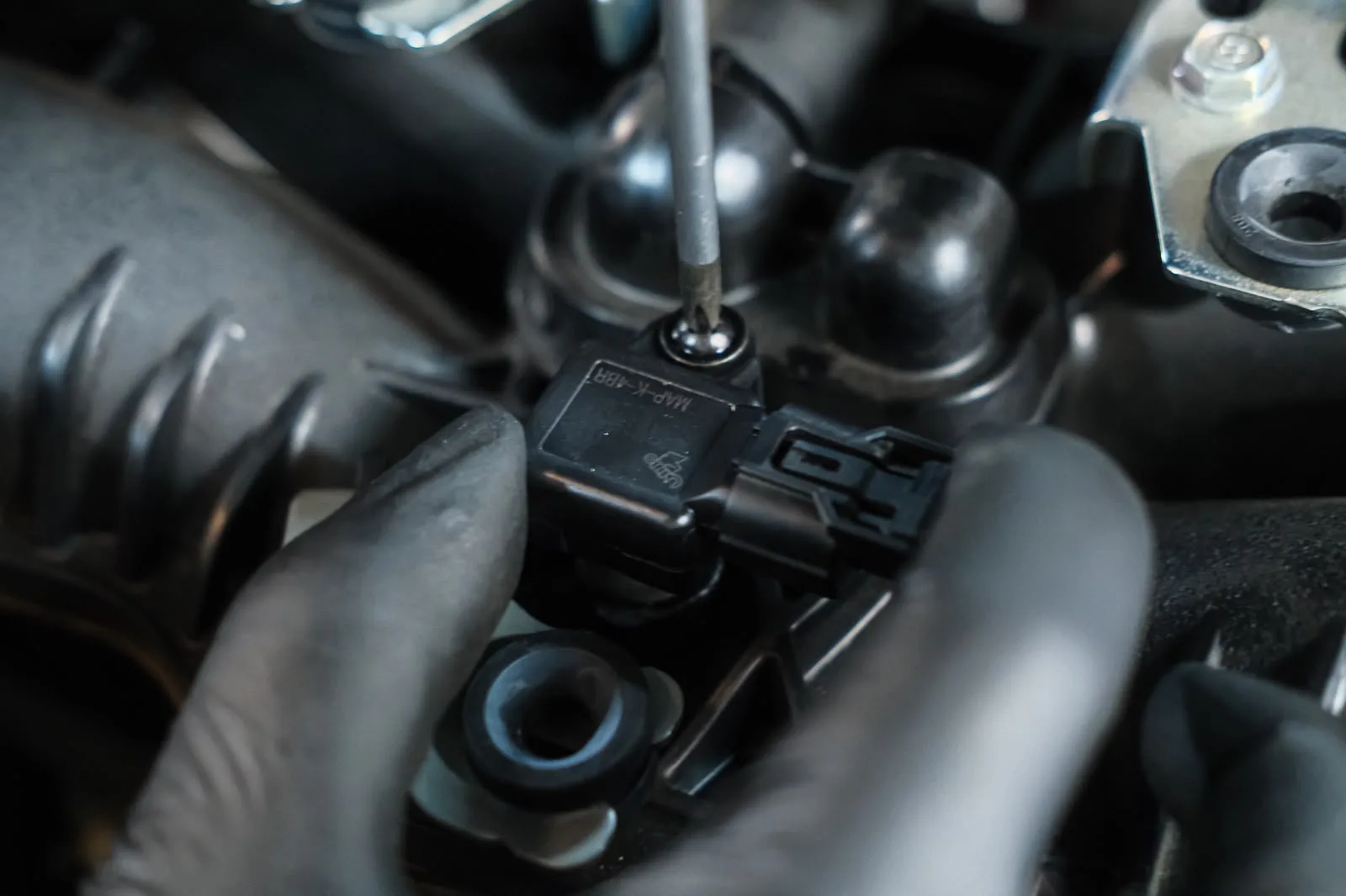 Omni Power 4 bar MAP sensor being fitted to the GR86 intake manifold