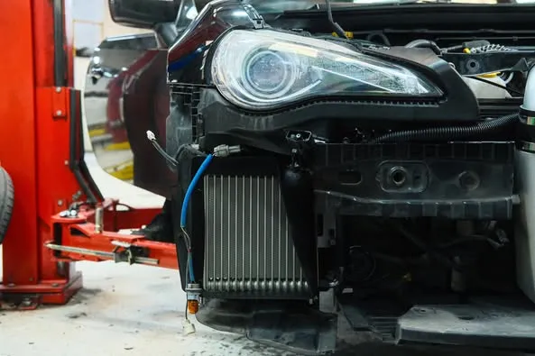 HKS turbo manifold and heat-wrapped dump pipe installed on Toyota 86 engine bay