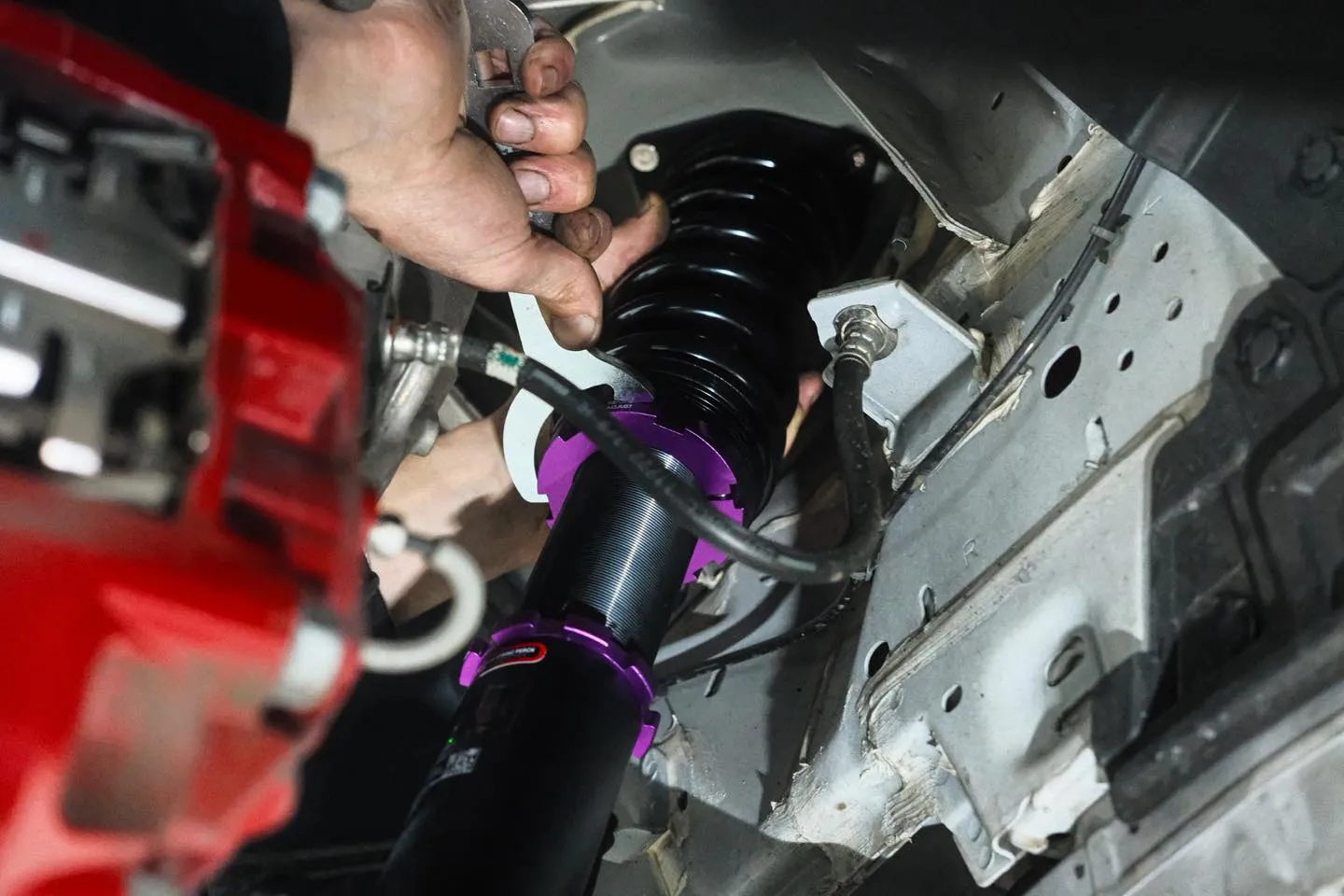 MCA Pro Street coilover being fitted into Nissan Z front strut tower