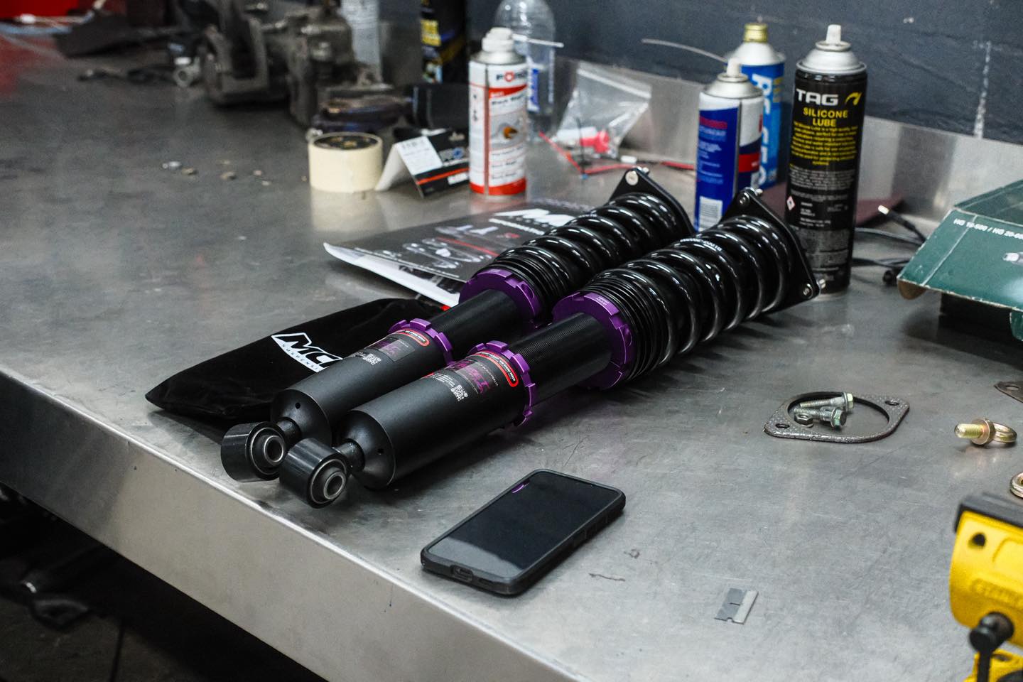 MCA Pro Street coilover assemblies on workbench ready for install