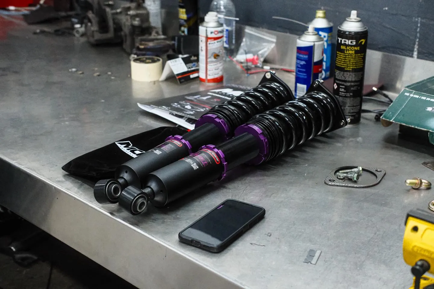 MCA Pro Street coilover assemblies on workbench ready for install