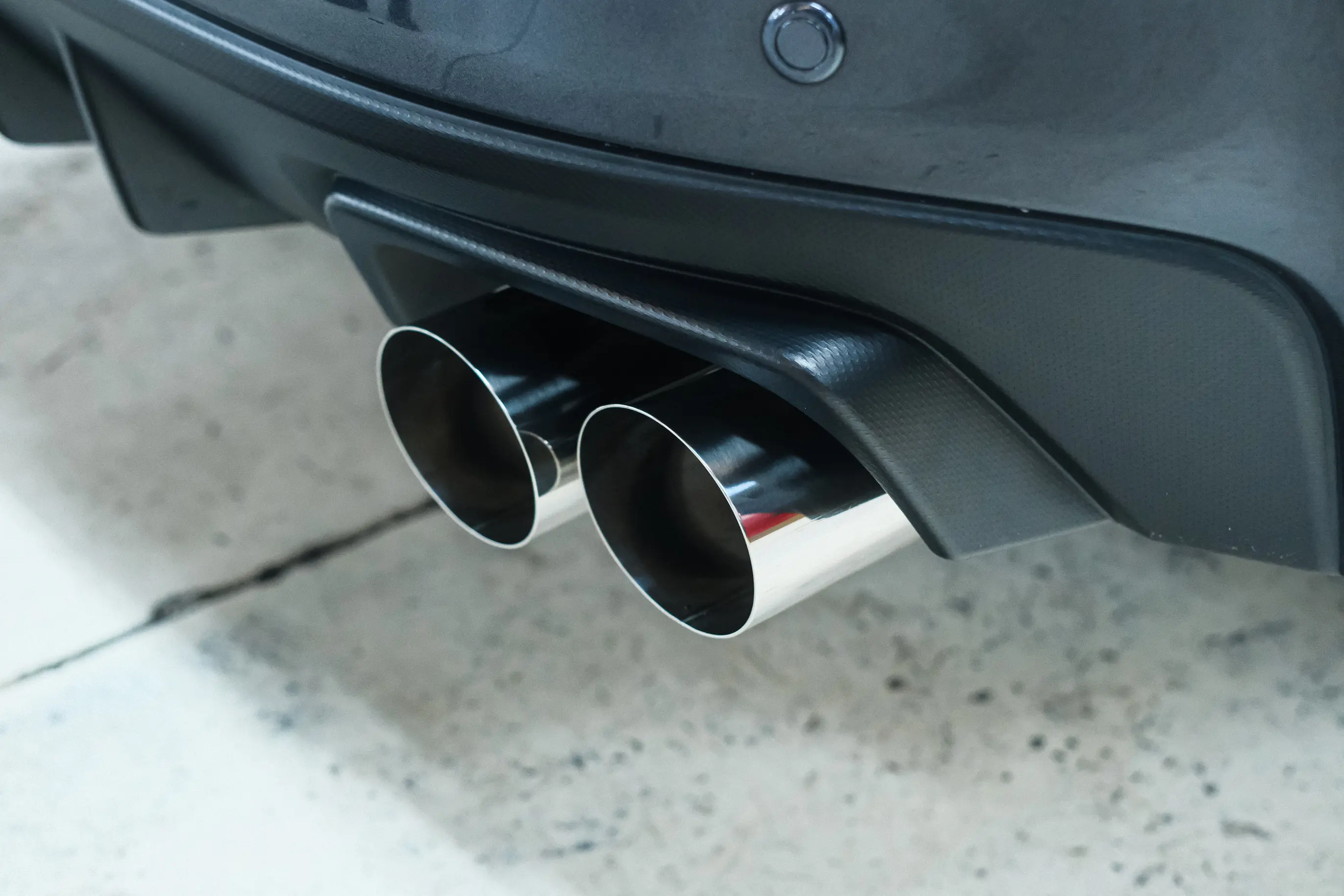 Mid-pipe section of HKS Legamax exhaust on a Subaru WRX VA
