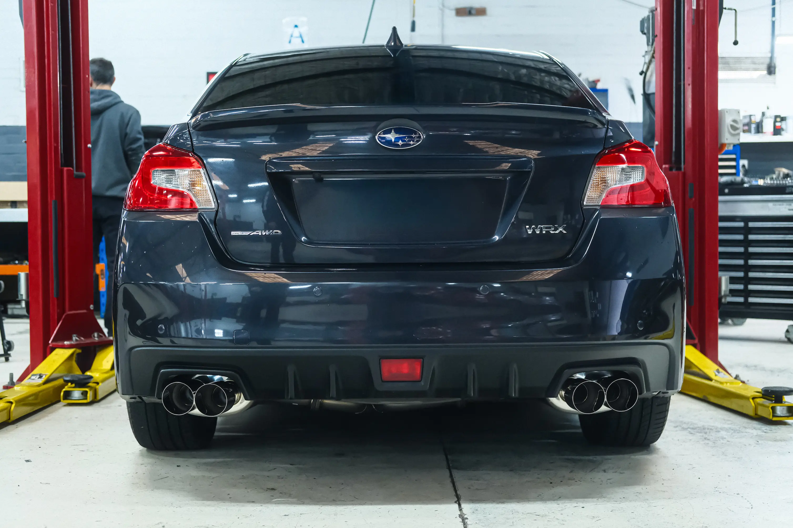 Rear muffler detail of HKS Legamax cat-back on a WRX VA
