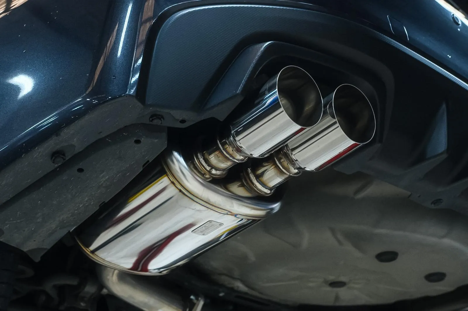 HKS Legamax tailpipe close-up fitted to a Subaru WRX VA