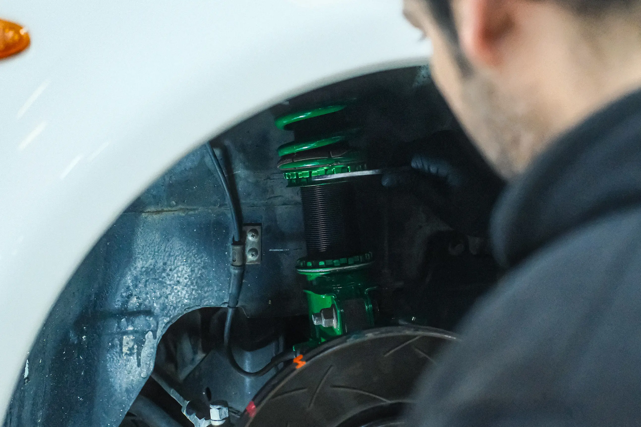 Mitsubishi Lancer Evo VI on the hoist during Tein Flex Z coilover fitting